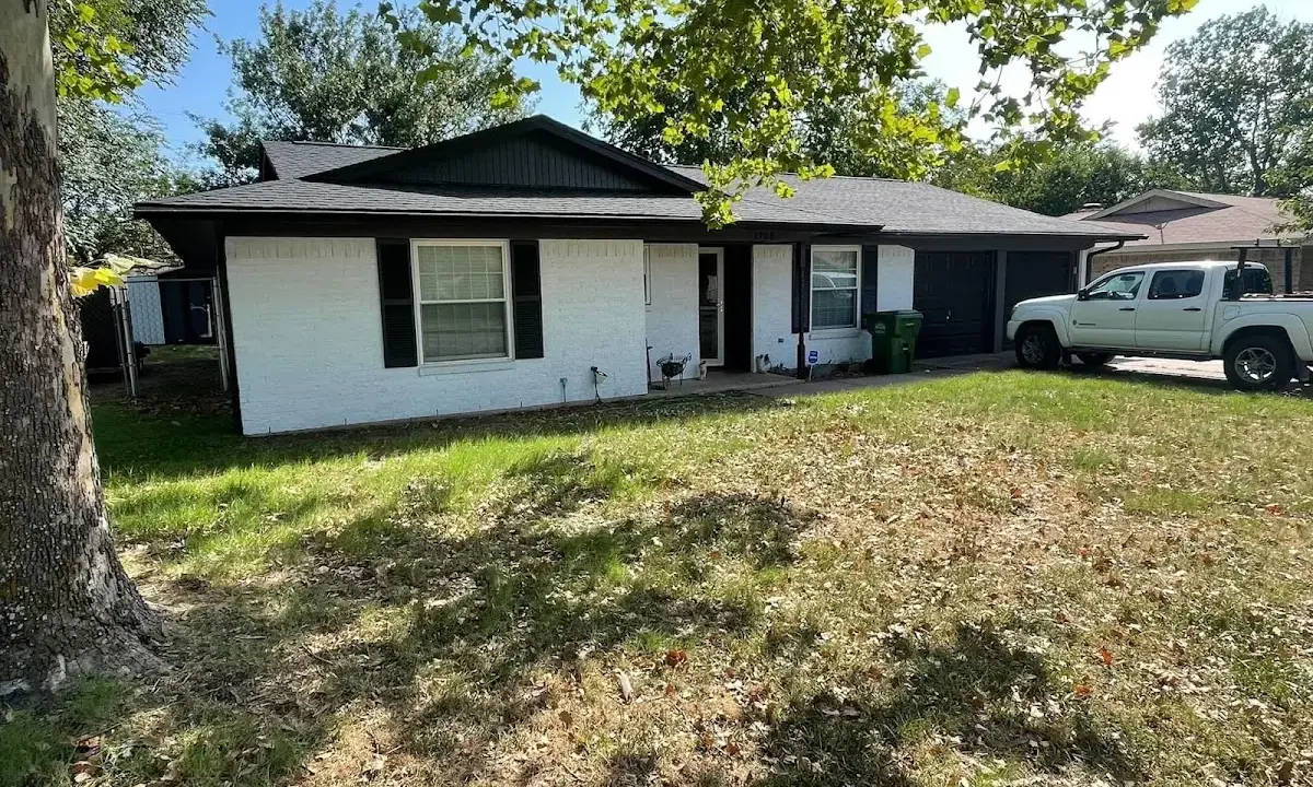 Professional roofing crew working on a residential roof in Black Forest